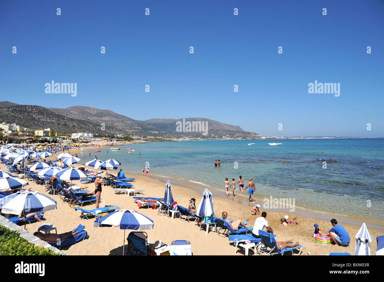 Wide sandy beach in Malia, Crete, Greece Stock Photo