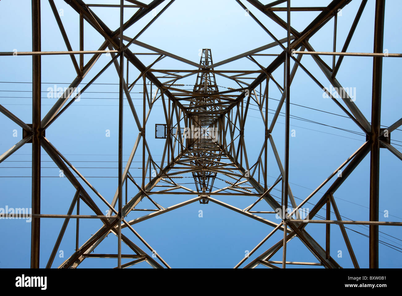 Australia, Victoria, Low angle view of power pylon near coal-fired Hazlewood Power Station on summer morning Stock Photo