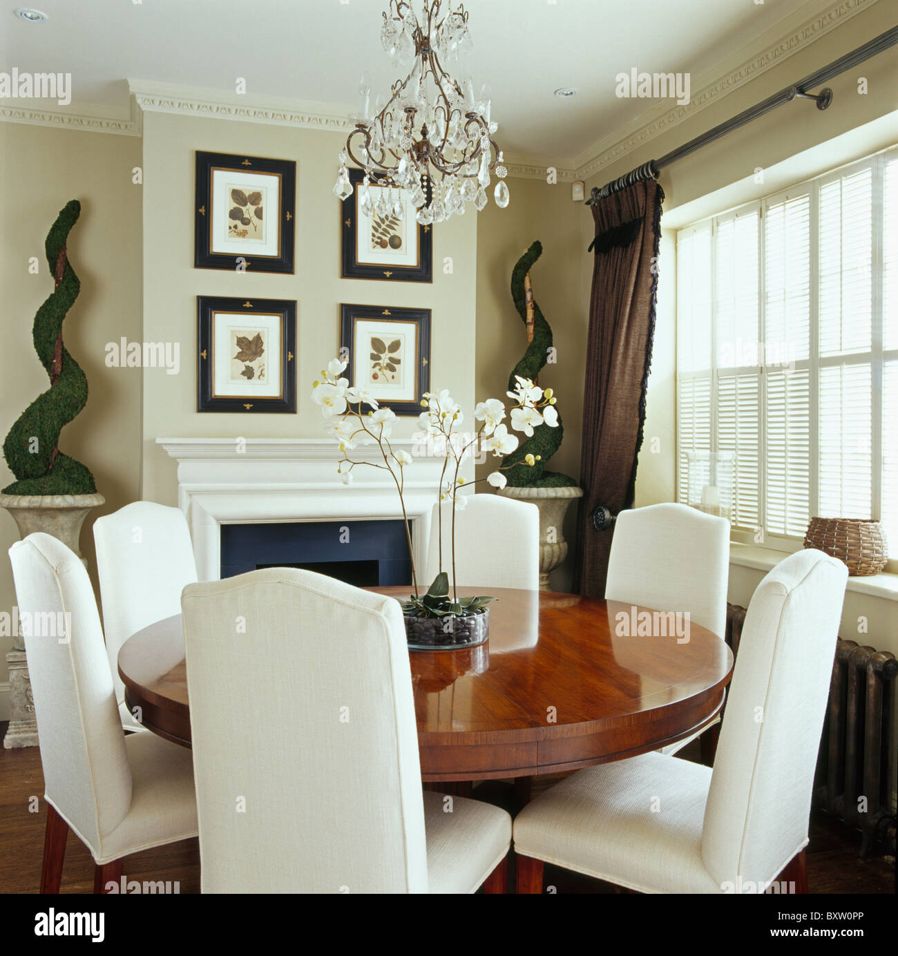 Tall Back White Upholstered Chairs And Circular Antique Table In