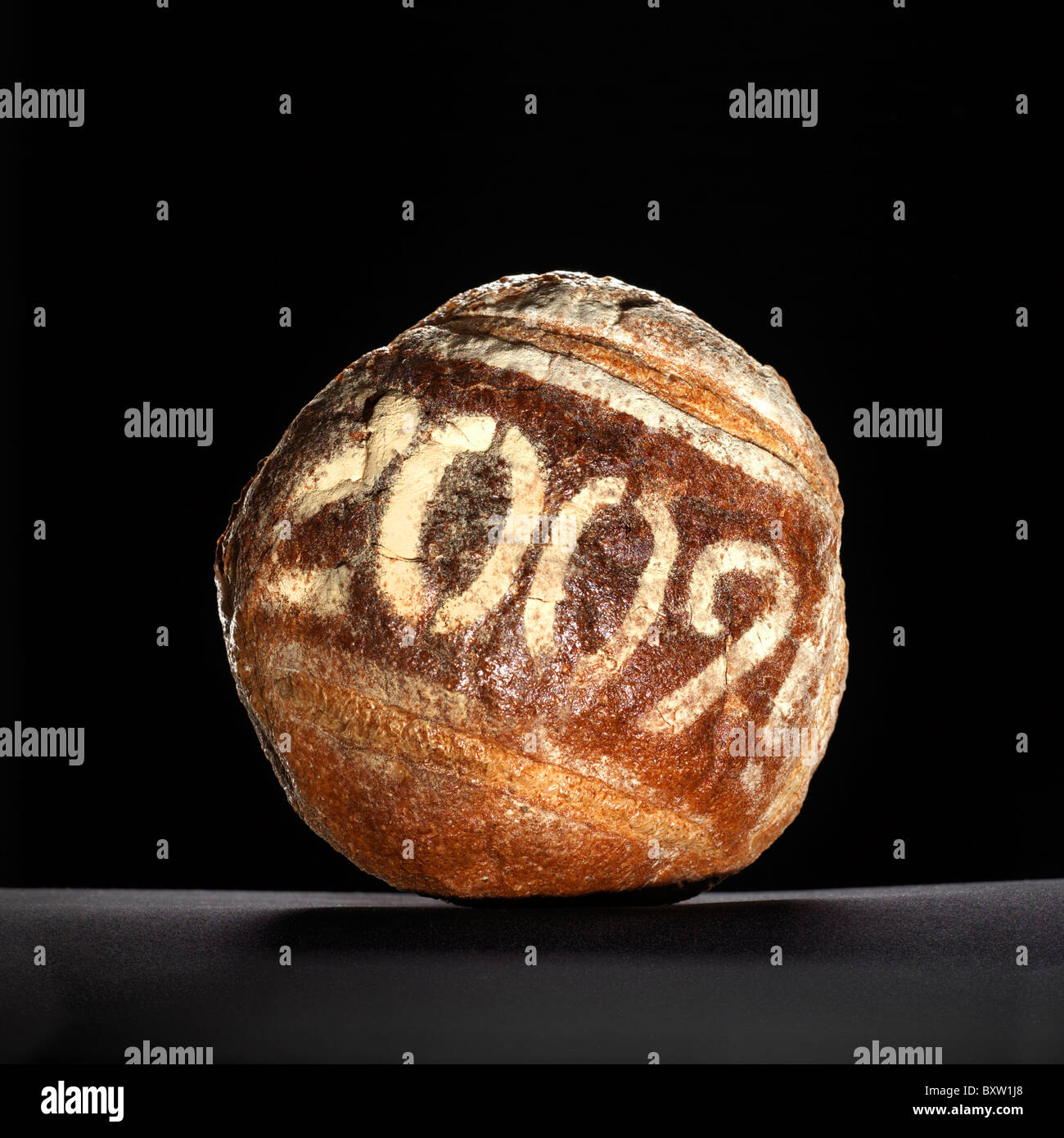 round loaf of bread dusted with a year date Stock Photo