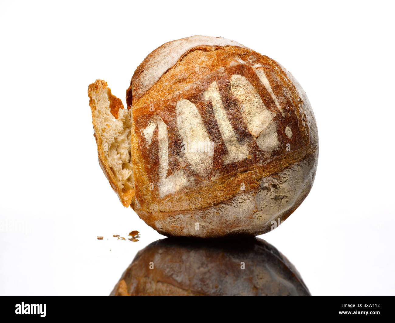 round loaf of bread dusted with the year 2010 Stock Photo