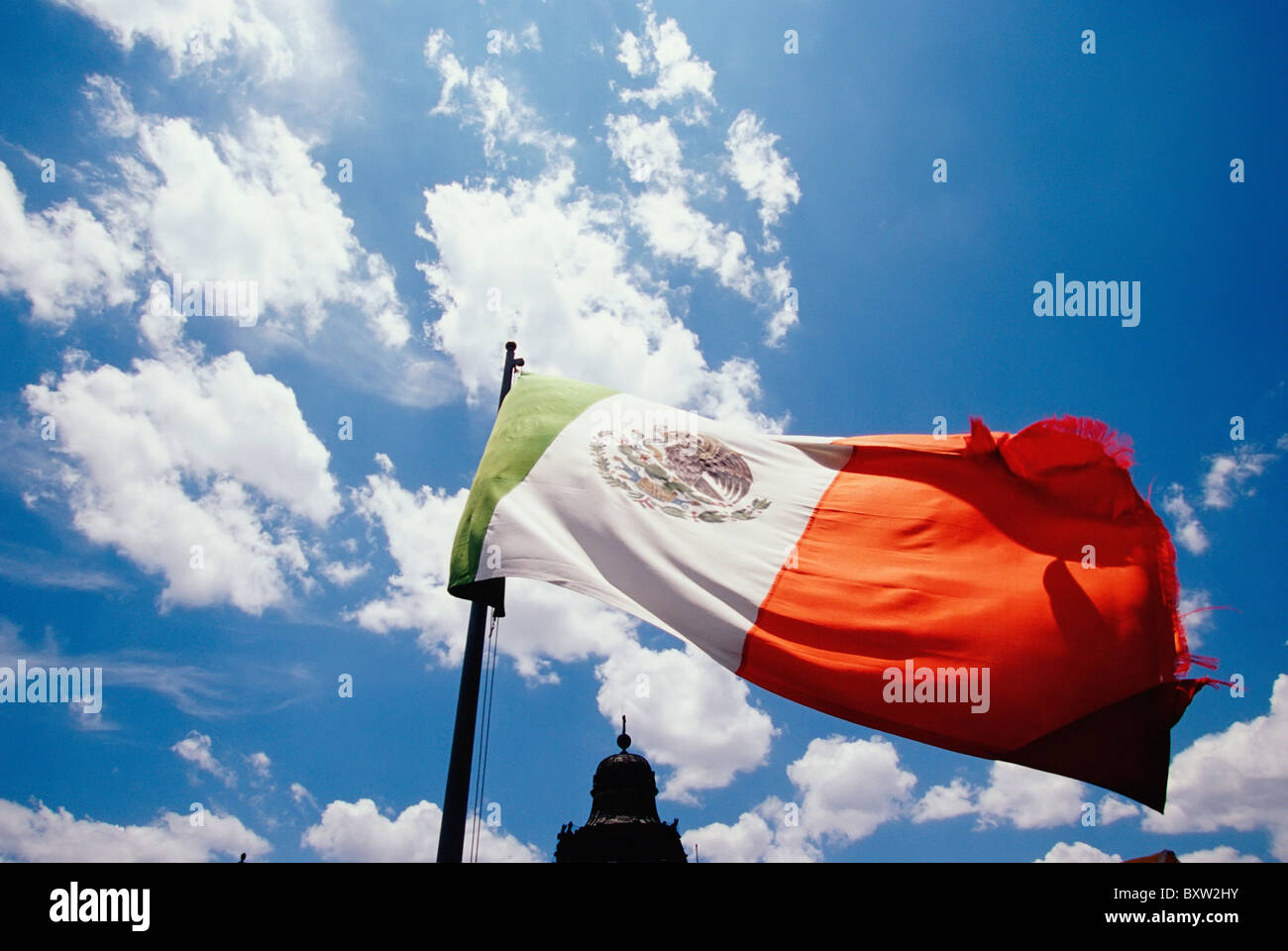 Mexican Flag And Top Of Building, Close Up Stock Photo