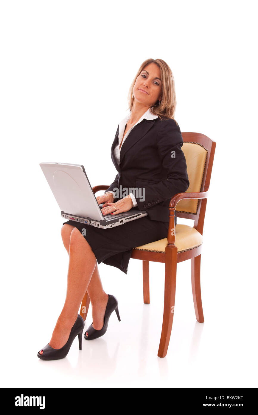 Businesswoman working with her laptop (isolated on white) Stock Photo