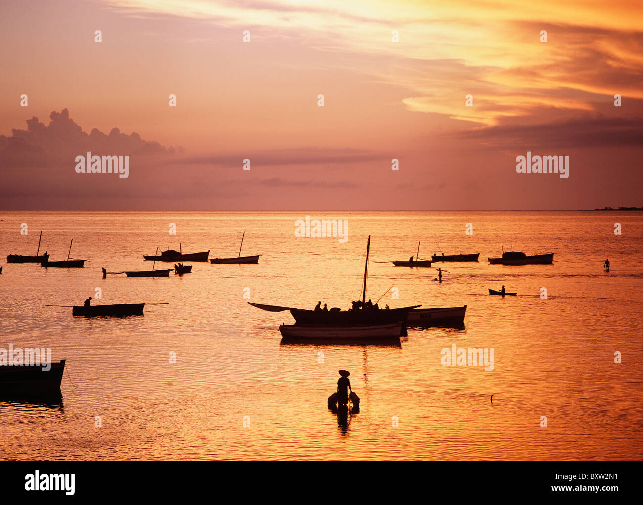Fishermen Preparing Their Dhows Before Heading Out To Sea At Dawn Stock Photo