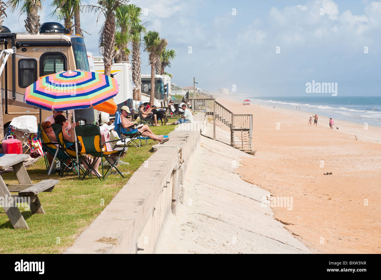 Campers enjoy the beach at a waterfront RV resort at Beverly Beach