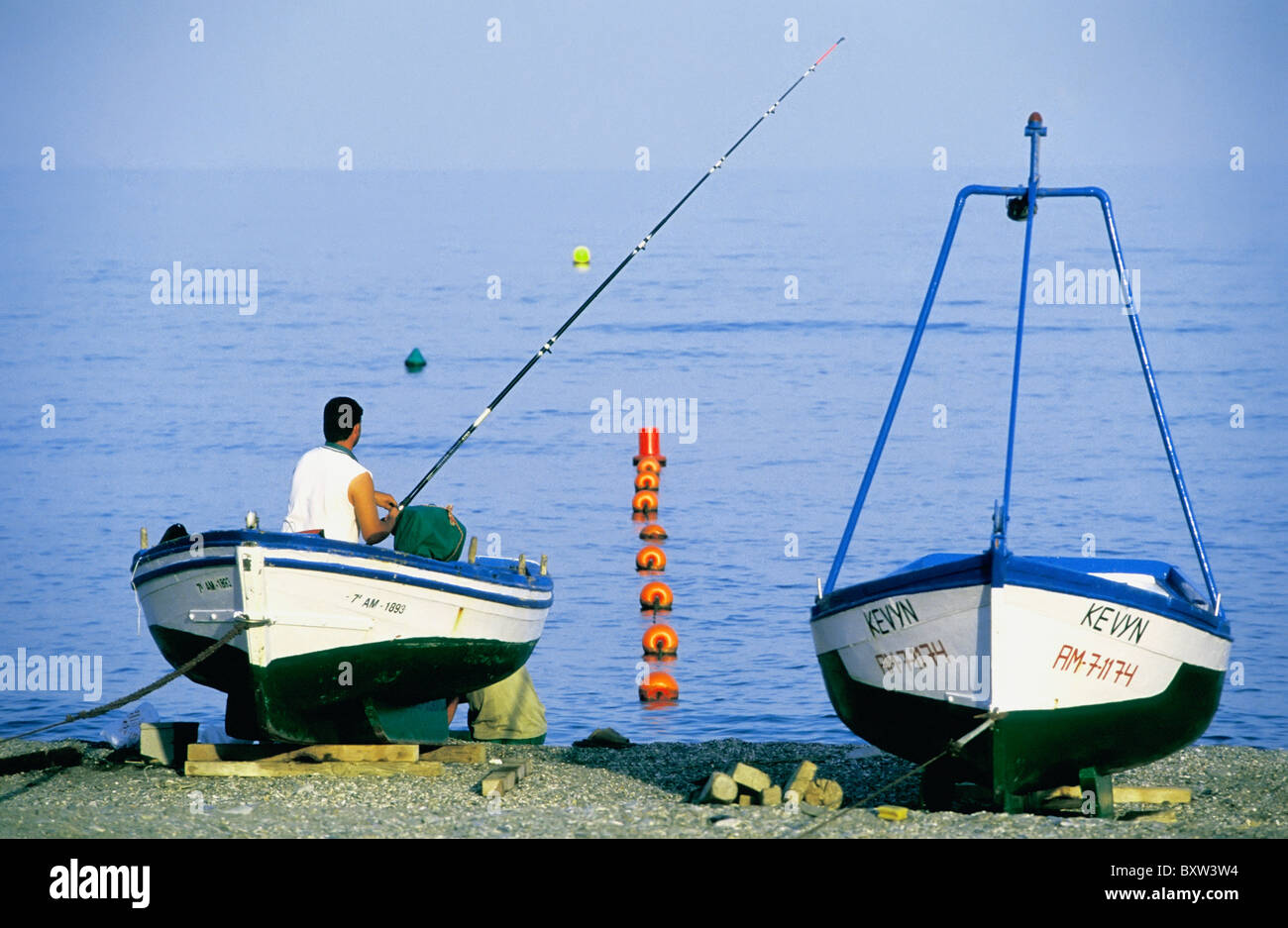 Fisherman sitting on boat hi-res stock photography and images - Alamy