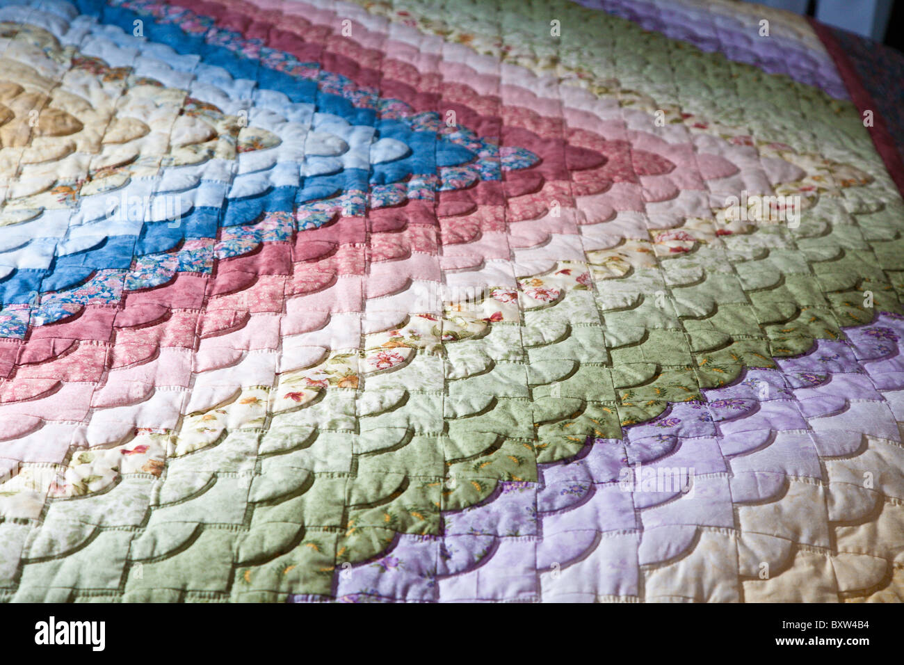 Sample of brightly colored Amish quilts made in and available for sale in Lancaster County, Pennsylvania Stock Photo