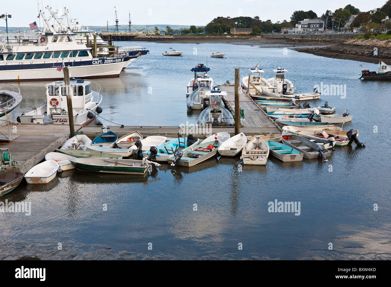 Small boats tied to floating dock in Plymouth Harbor in Plymouth