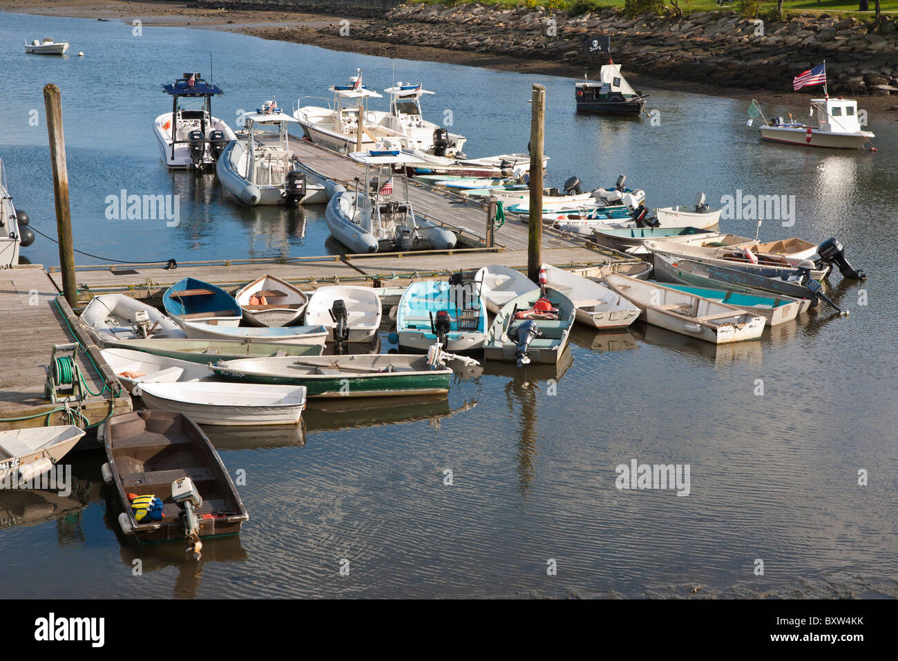 Small boats tied to floating dock in Plymouth Harbor in Plymouth