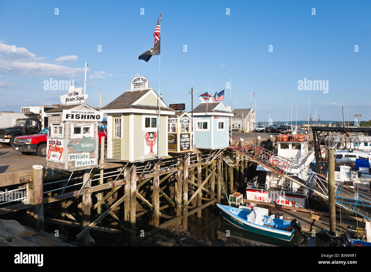 Cruise and fishing charter businesses on the Town Wharf in Plymouth Massachusetts Stock Photo