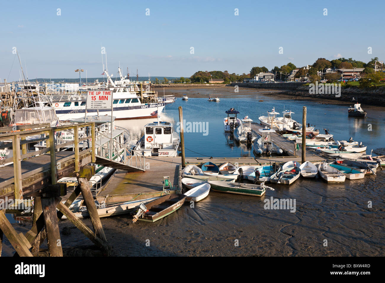 Small boats tied to floating dock in Plymouth Harbor in Plymouth