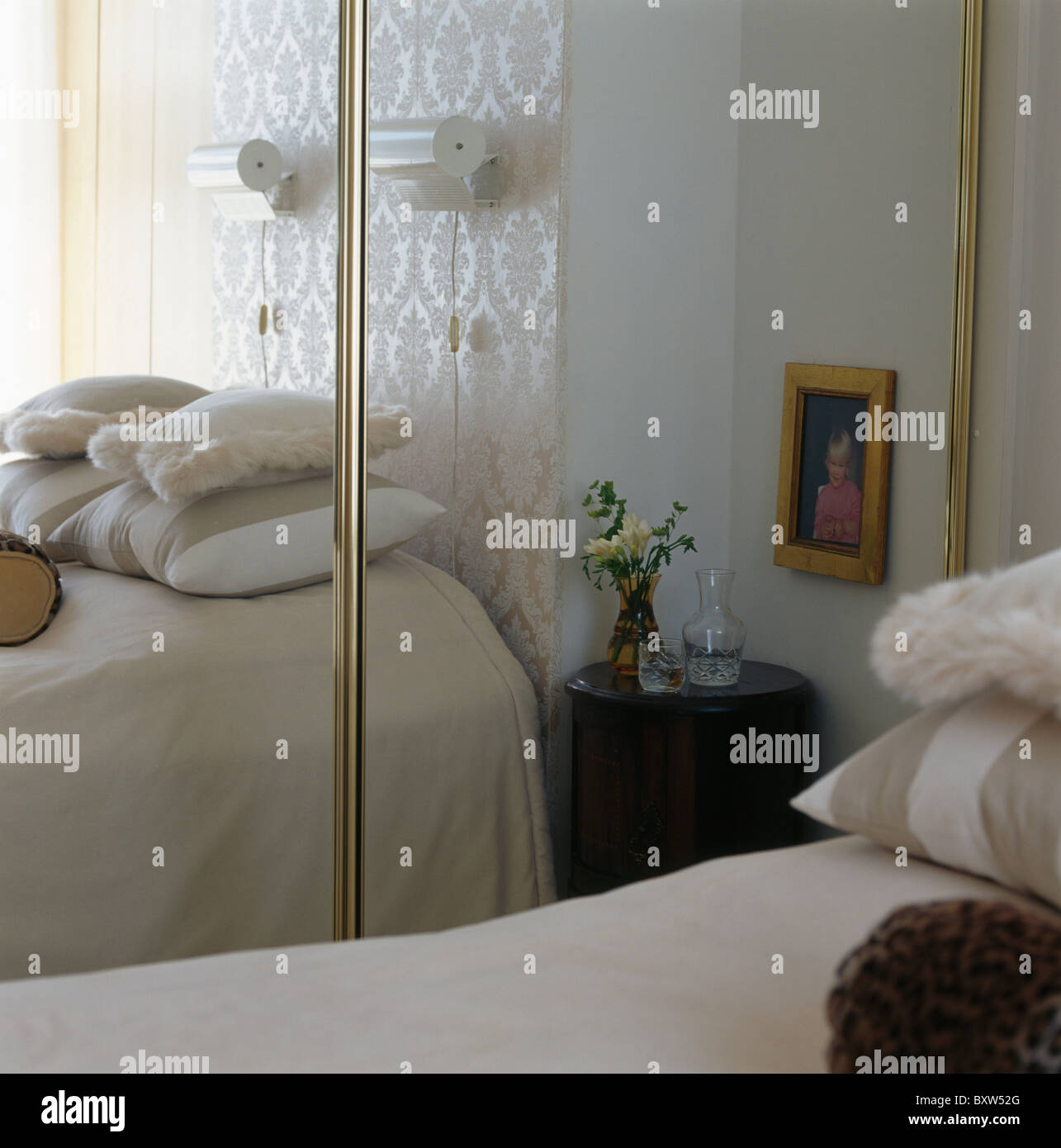 Mirrored Doors On Fitted Wardrobe In Small Townhouse Bedroom