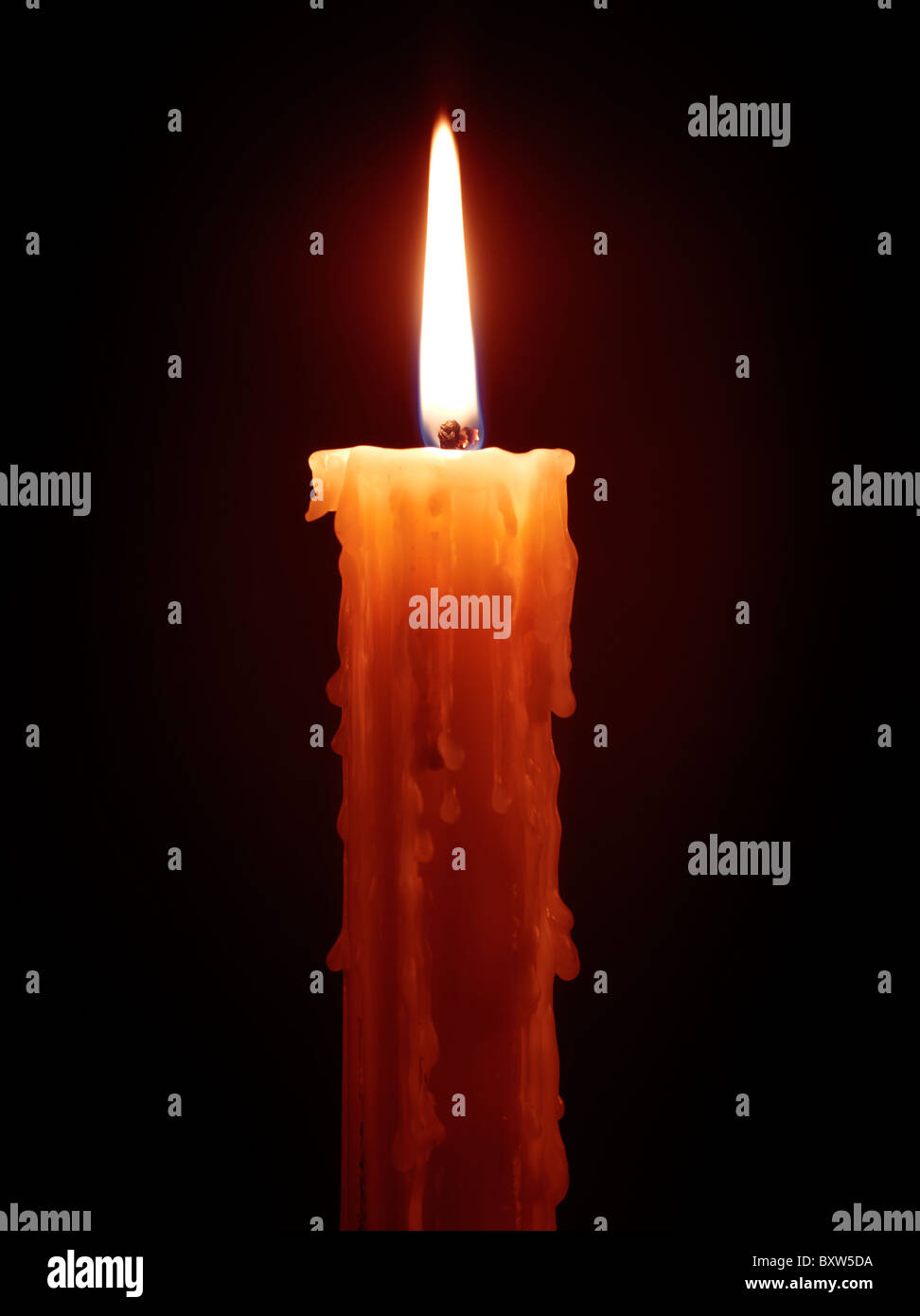 Burning candle isolated on black background Stock Photo Alamy