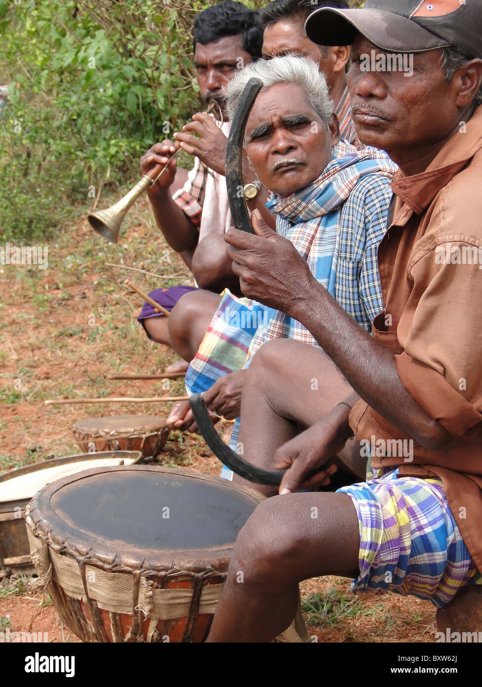 ORISSA, INDIA - Nov 12 -Tribal musicians play dance music on Nov 12, 2009, in Lamptaput, Orissa, India  Stock Photo
