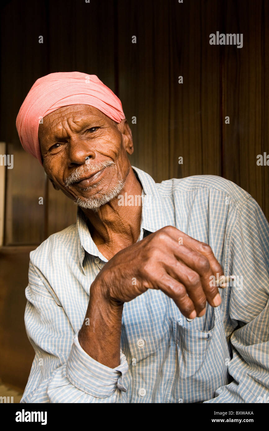 A man smokes a beedi in Ahmedabad, Gujarat, India. Stock Photo