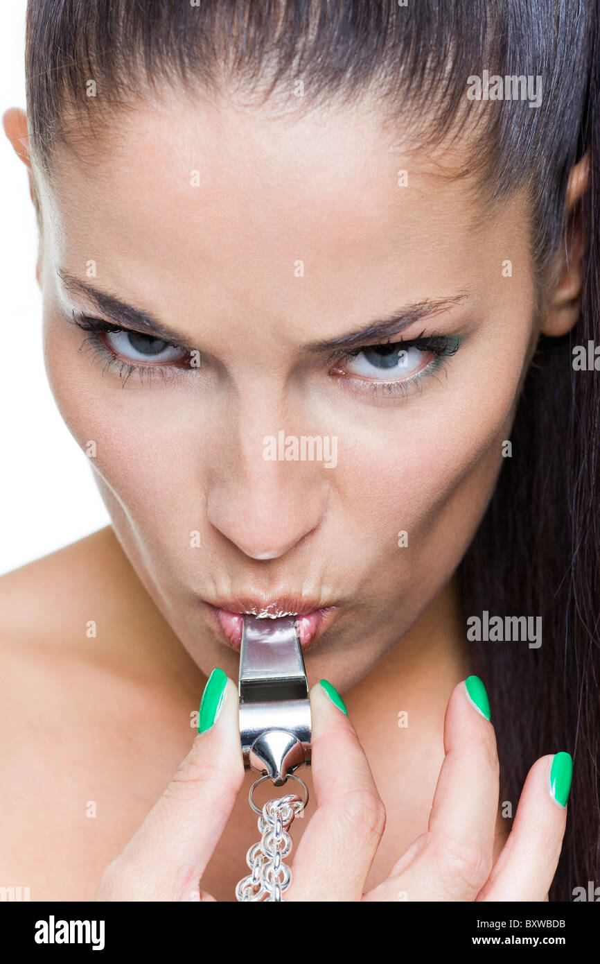Young woman blowing whistle Stock Photo Alamy