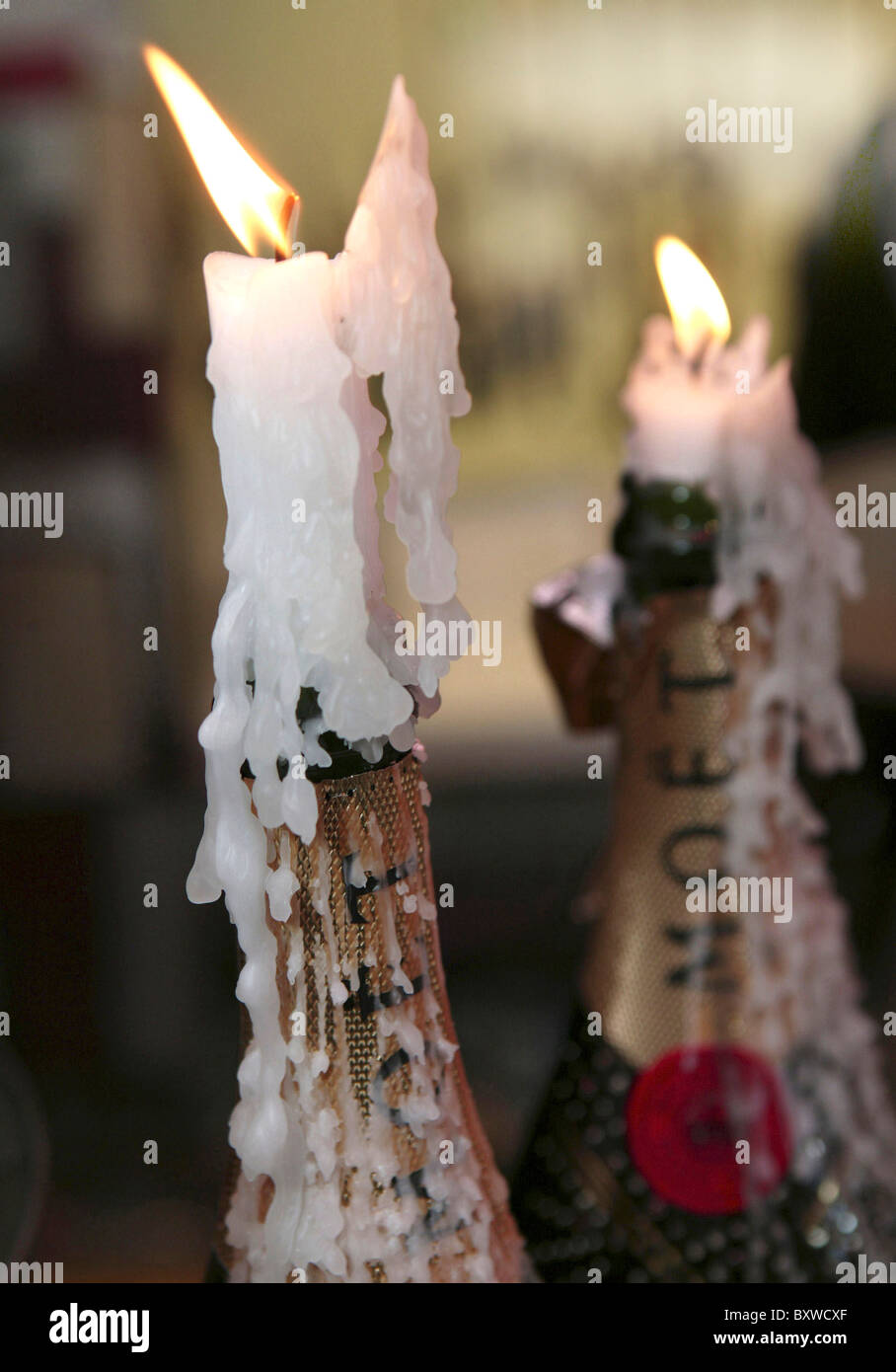 Champagne Bottles with Candles Stock Photo - Alamy