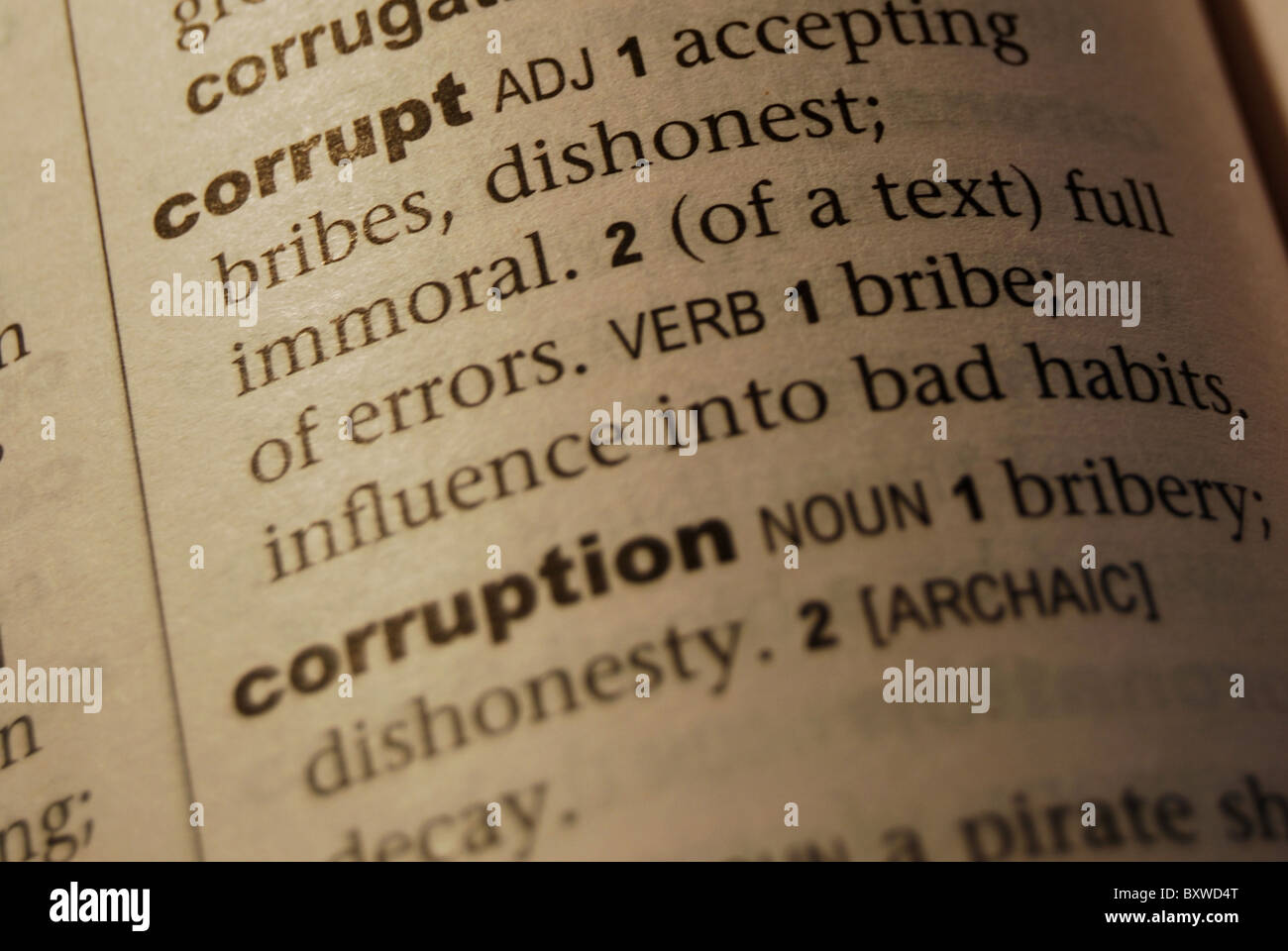 A detailed photo illustration of the Corrupt word description in an English Dictionary. Stock Photo