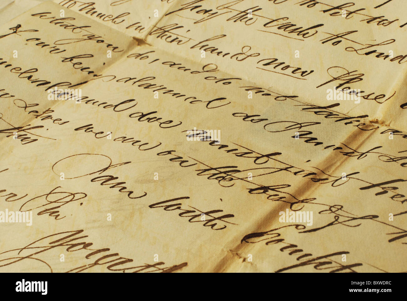 Old letter with elegant handwriting. Close up of old letter with elegant handwriting. Stock Photo