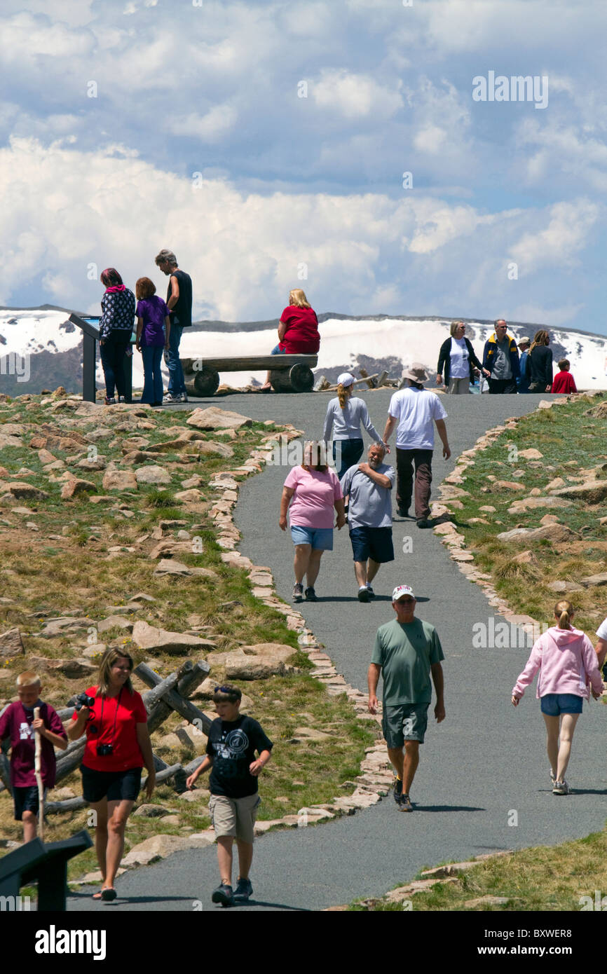 Tourists view the Rocky Mountains from a scenic overlook in the Rocky Mountain National Park, Colorado, USA. Stock Photo