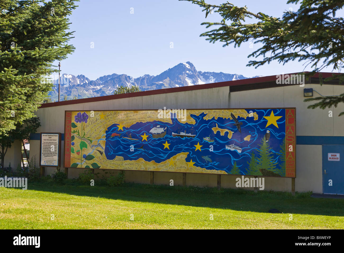 Painted mural on buildings in downtown Seward Alaska on the Kenai peninsula of Alaska Stock Photo