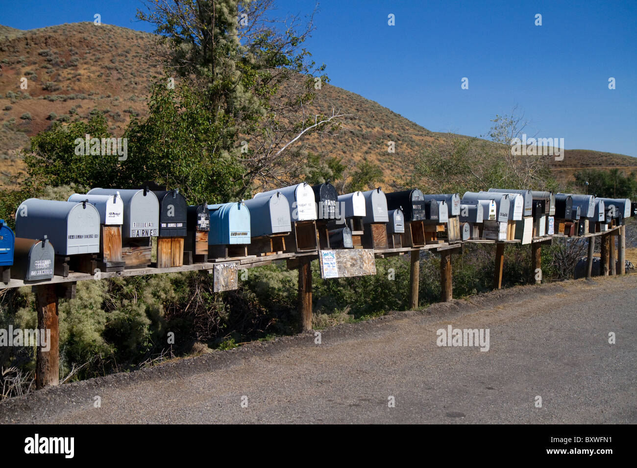 Mailboxes lined up for the delivery of mail in a rural area near Challis, Idaho, USA. Stock Photo