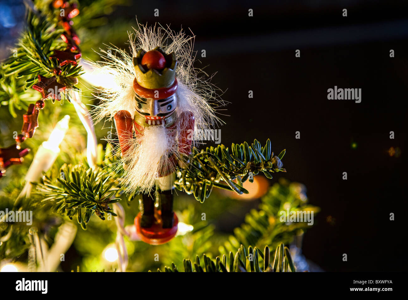A nutcracker soldier hanging from a christmas tree Stock Photo