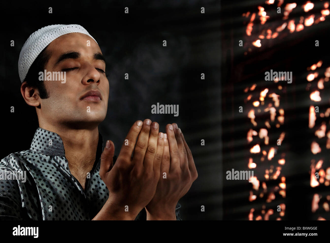 Muslim man praying Stock Photo