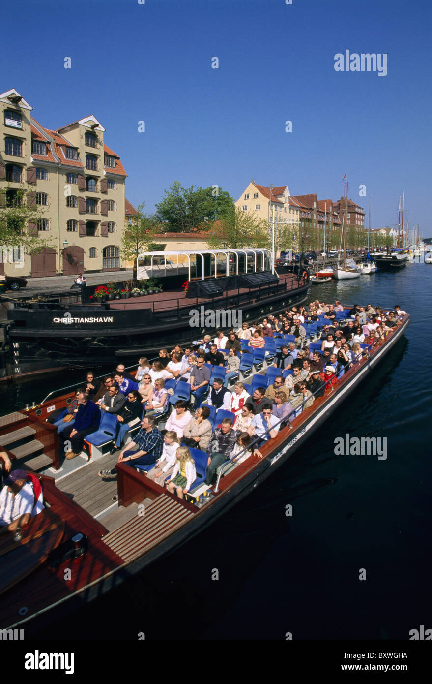 Boat with tourists, Christianshavn Canal, Copenhagen, Denmark Stock Photo