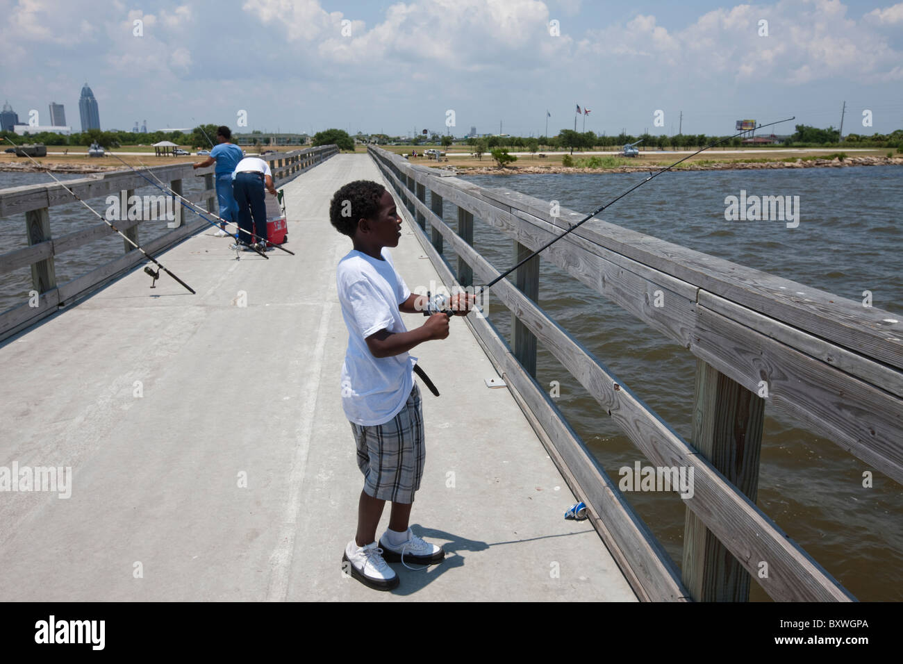 African american boy fishing in hi-res stock photography and