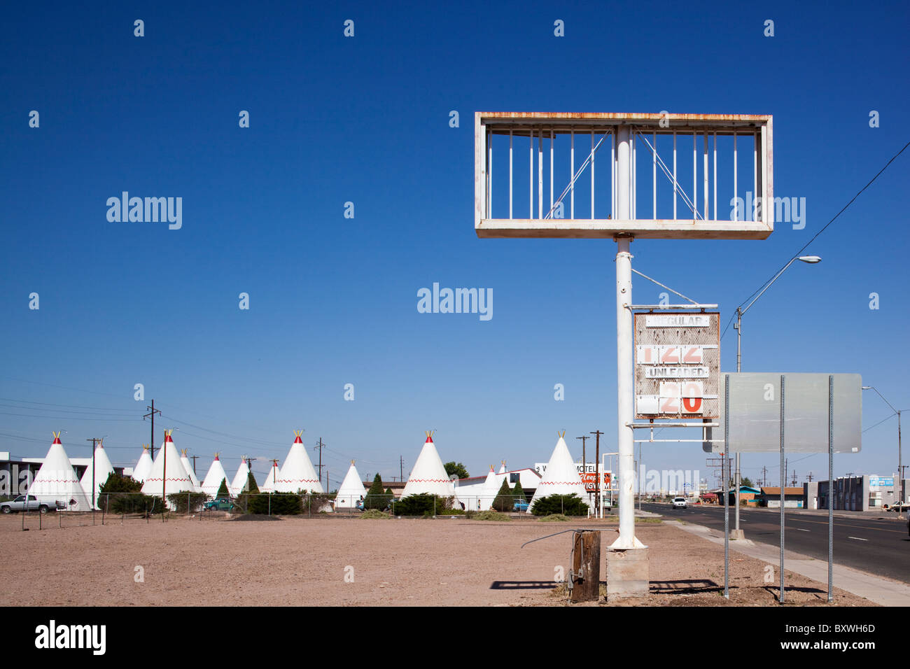 USA, Arizona, Holbrook, Abandoned gas station and Wigwam Motel along Route 66 on summer morning Stock Photo