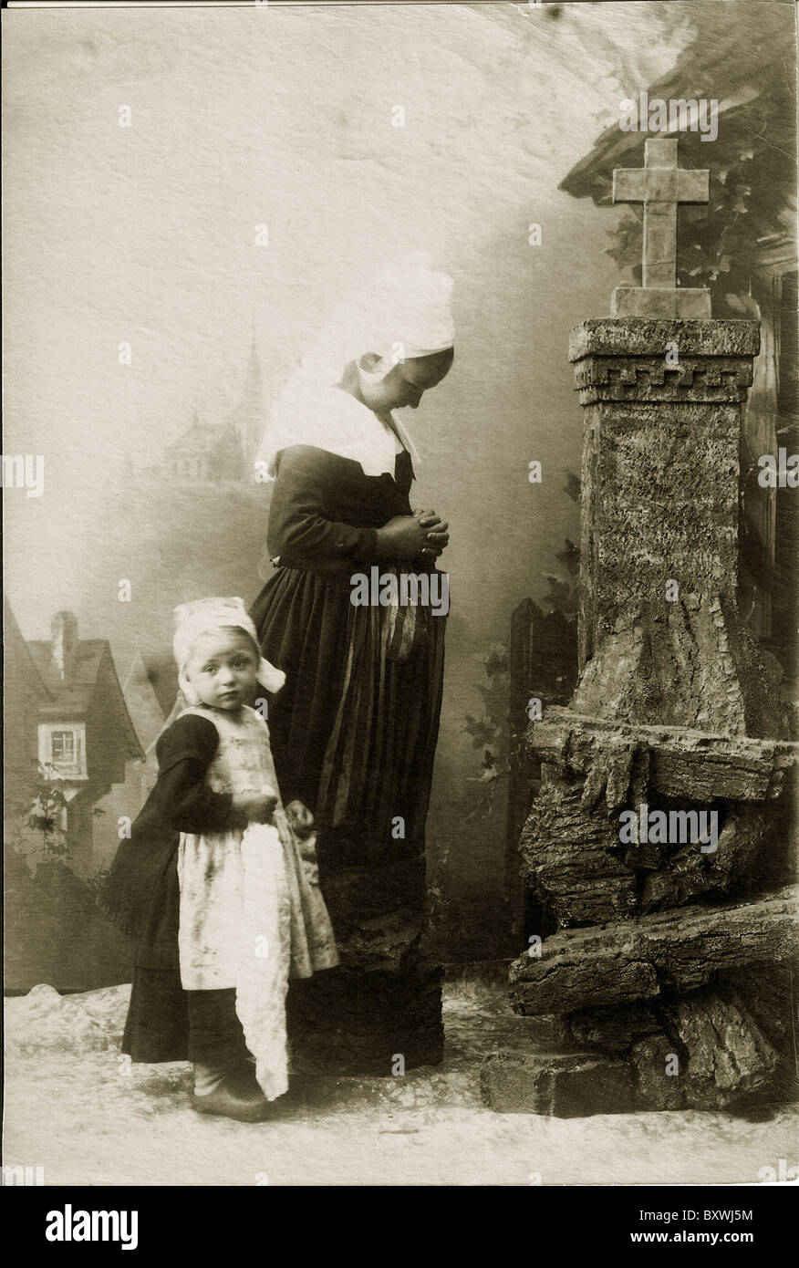 Mother and Child Praying; Wooden shoes; Holland; Dutch;1880's; Stock Photo