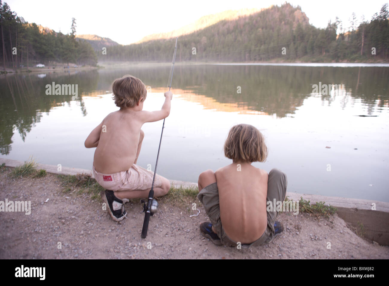 Two young boys fishing.  Fenton Lake, Jemez Springs, New Mexico, USA Stock Photo