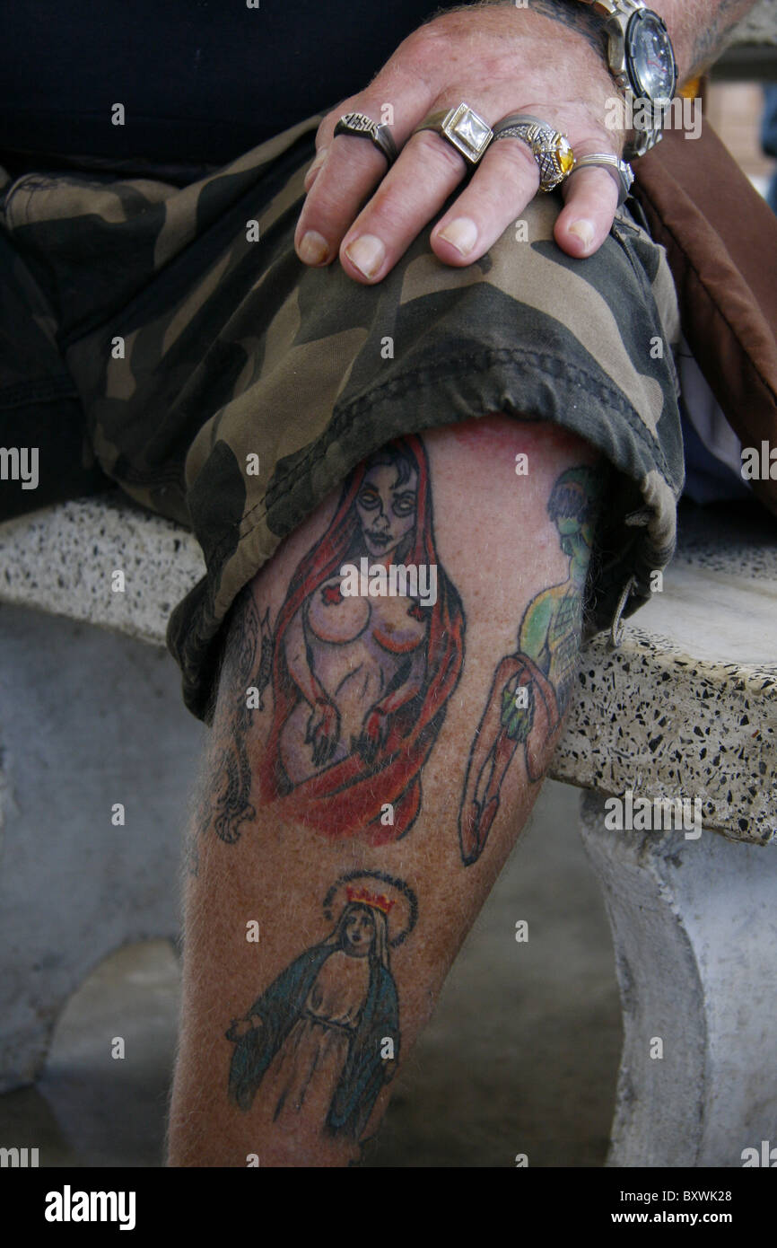 The tattoos of an American Vietnam war veteran, on the Thai Cambodian