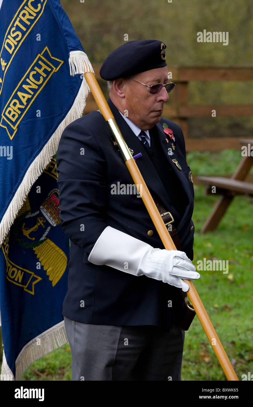 Flag bearer at Remembrance parade. Stock Photo