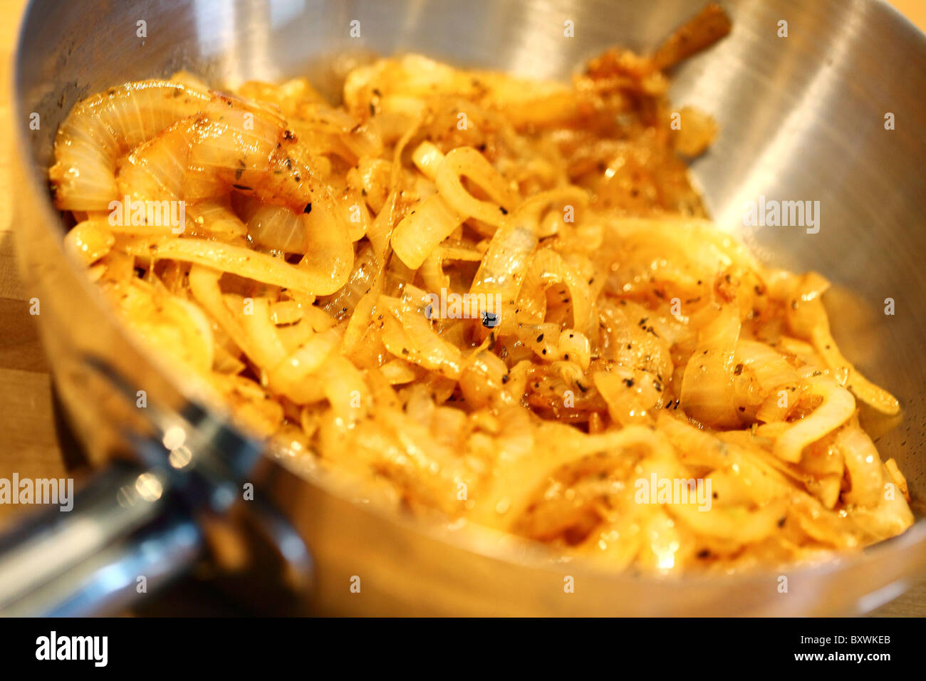 Onions, braising in  a casserole, Stock Photo