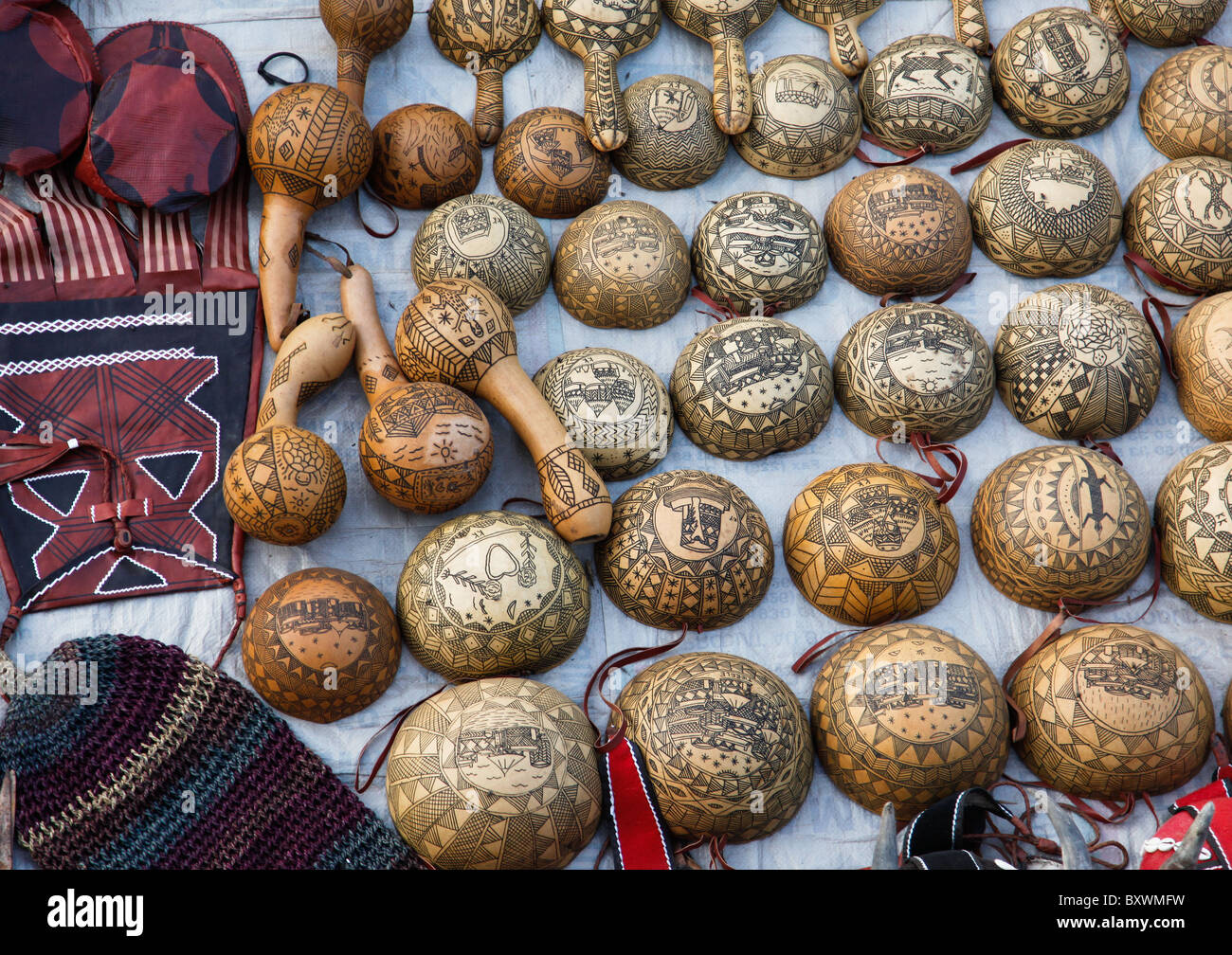At the biannual Salon International de l'Artisanat de Ouagadougou SIAO in Burkina Faso vendors sell carved calabashes and gourds Stock Photo
