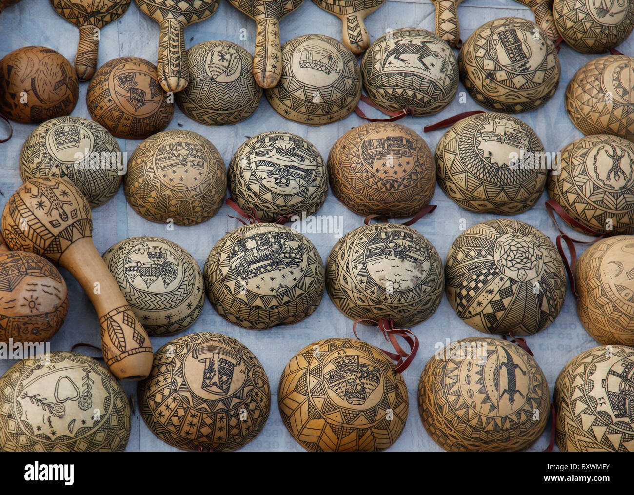 At the biannual Salon International de l'Artisanat de Ouagadougou SIAO in Burkina Faso vendors sell carved calabashes and gourds Stock Photo