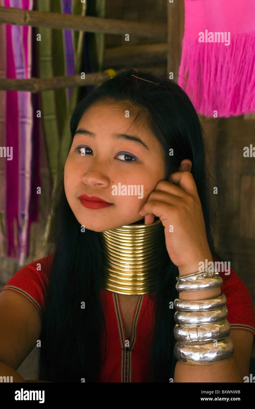 A Karen Paduang refugee woman wearing gold rings around her neck is