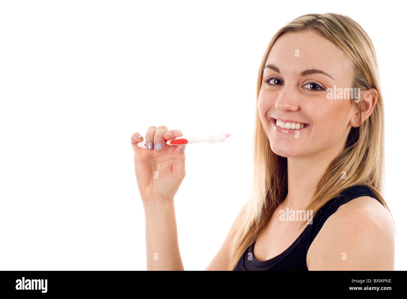 Happy Healthy Girl Brushing her Teeth - Isolated over a white background, a lot of copyspace. Stock Photo