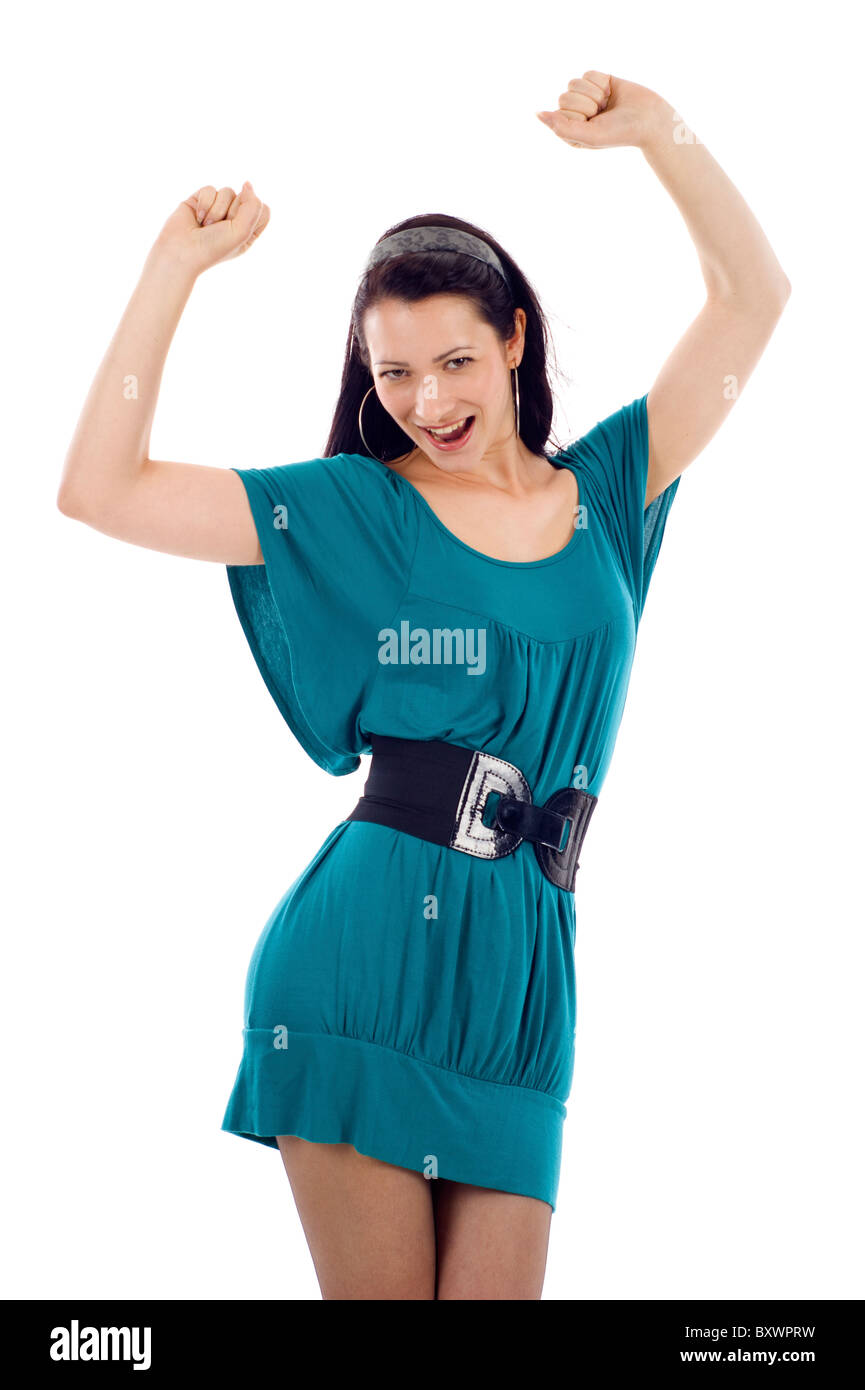 Smiling excited young woman rejoicing success with hands raised isolated over a white background Stock Photo