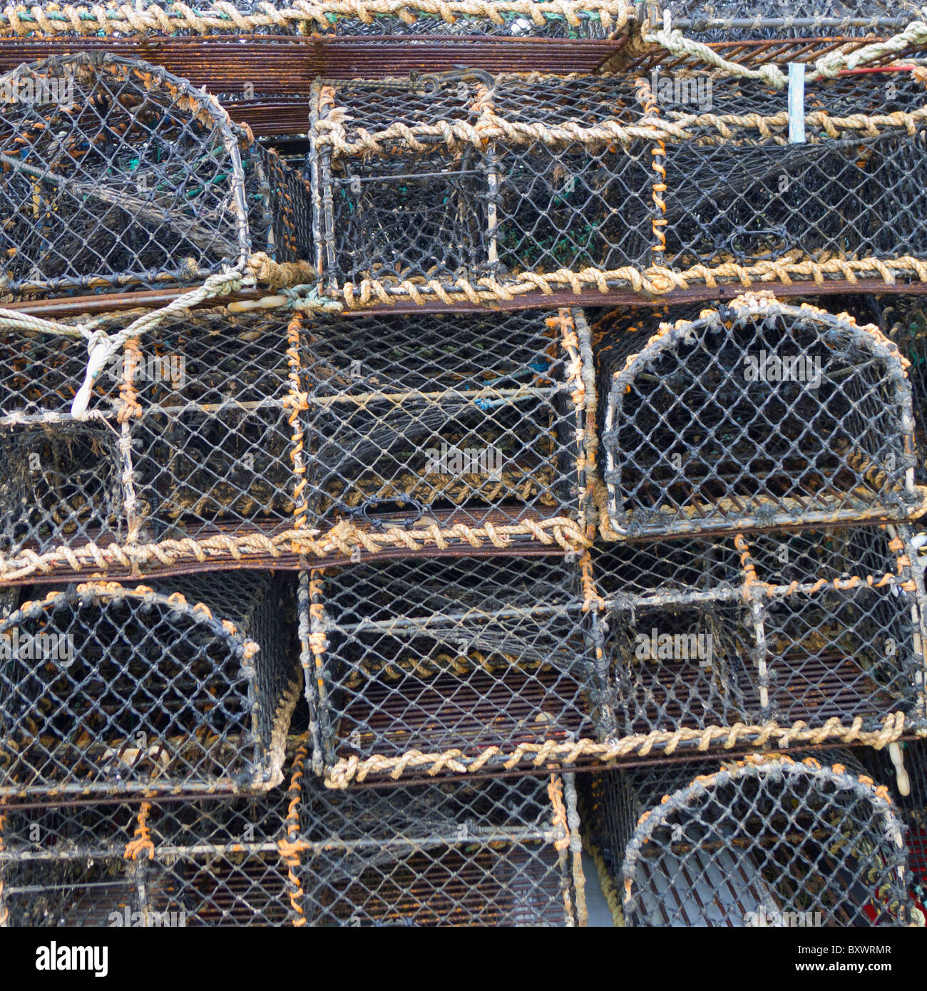 Lobster pots stacked up at Brancaster Staithe on the Norfolk coast. Stock Photo