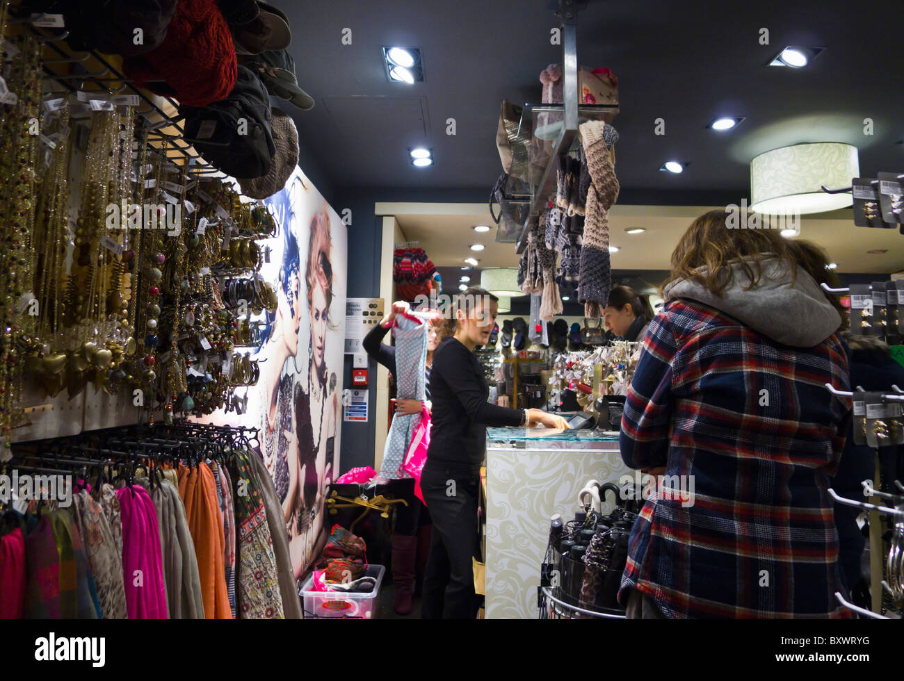 Shoppers and sales assistants in an Accessorize store Stock Photo Alamy