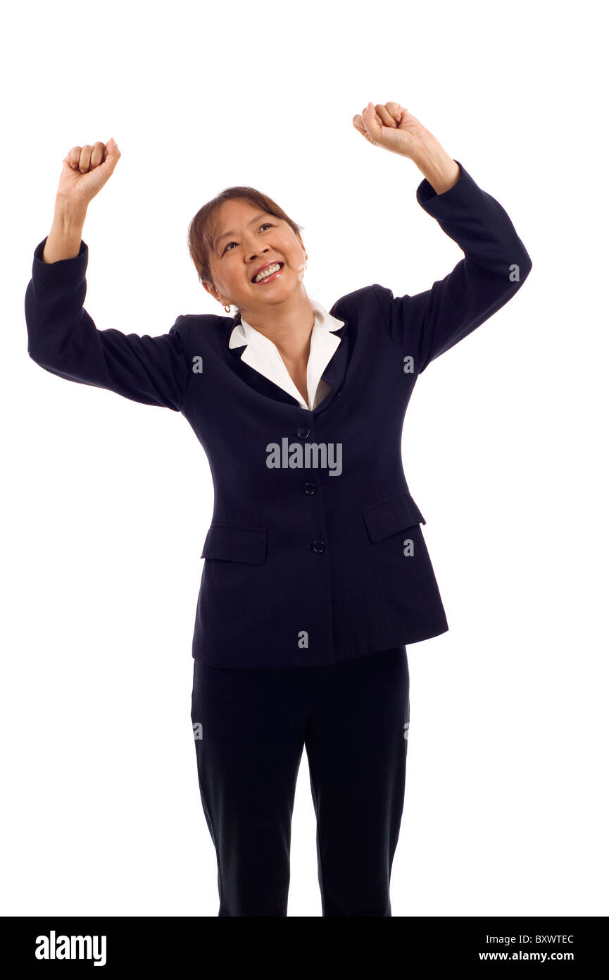 Successful senior Asian American business woman happy for her success isolated over white background Stock Photo