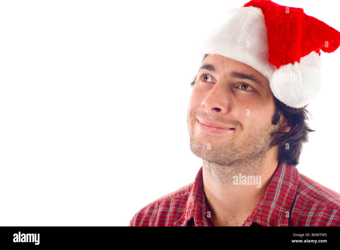 Smiling Man with Christmas Red Hat Looking Pensive -Isolated over a white background Stock Photo