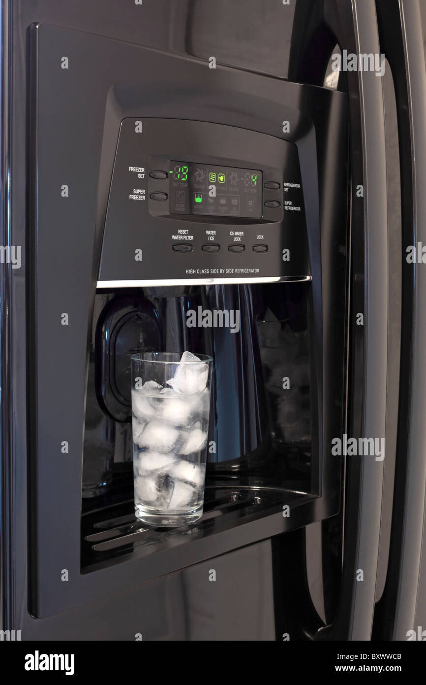 Fridge freezer chilled water and ice dispenser Stock Photo