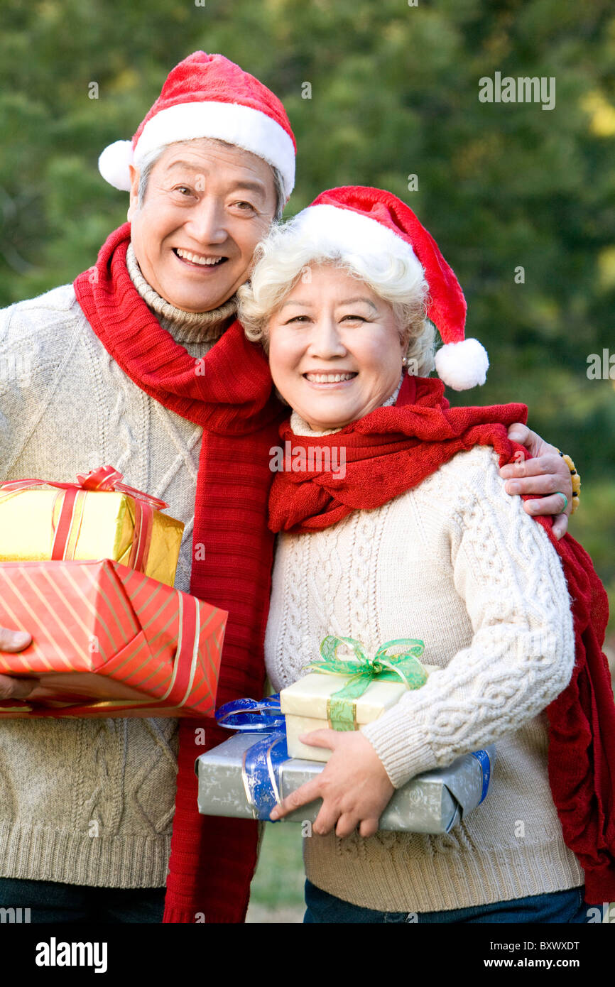 Men in santa hats holding hi-res stock photography and images - Alamy