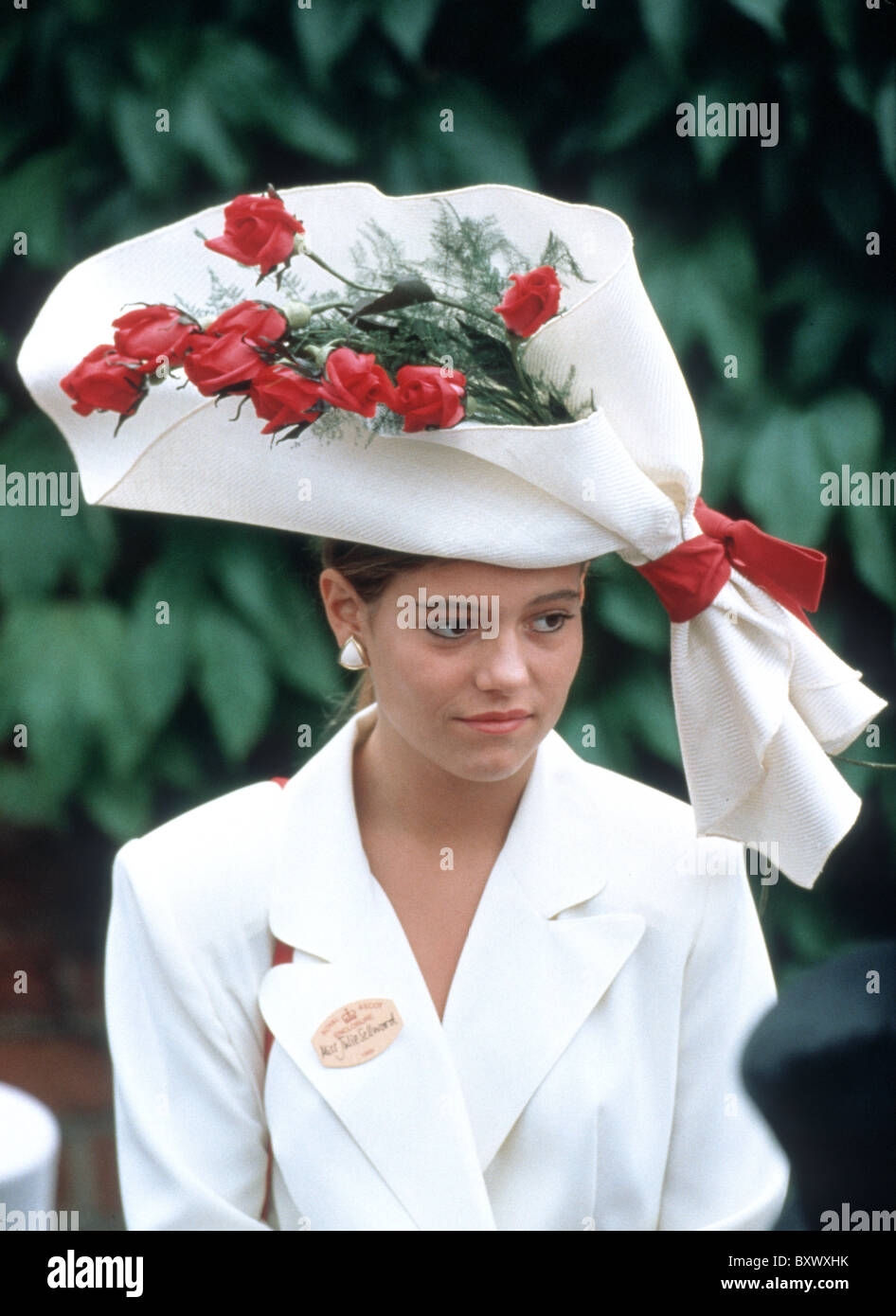 Woman with Bouquet of flowers hat at Ascot Races, Britain Stock Photo ...
