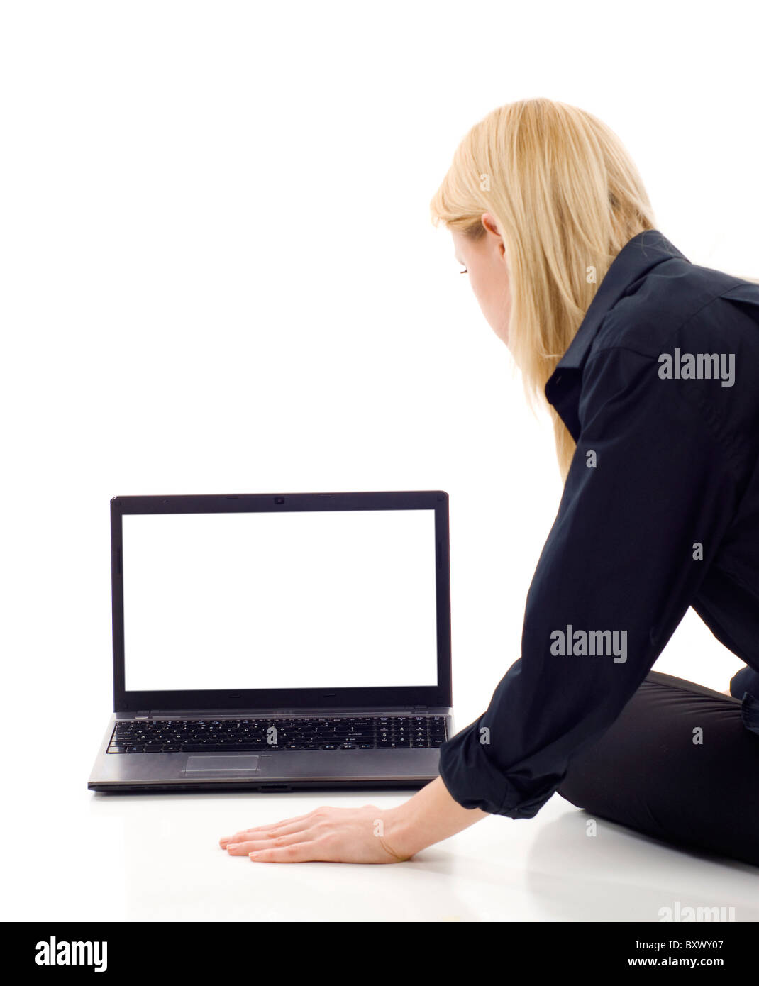 Business woman from the back - looking at the laptop screen over a ...