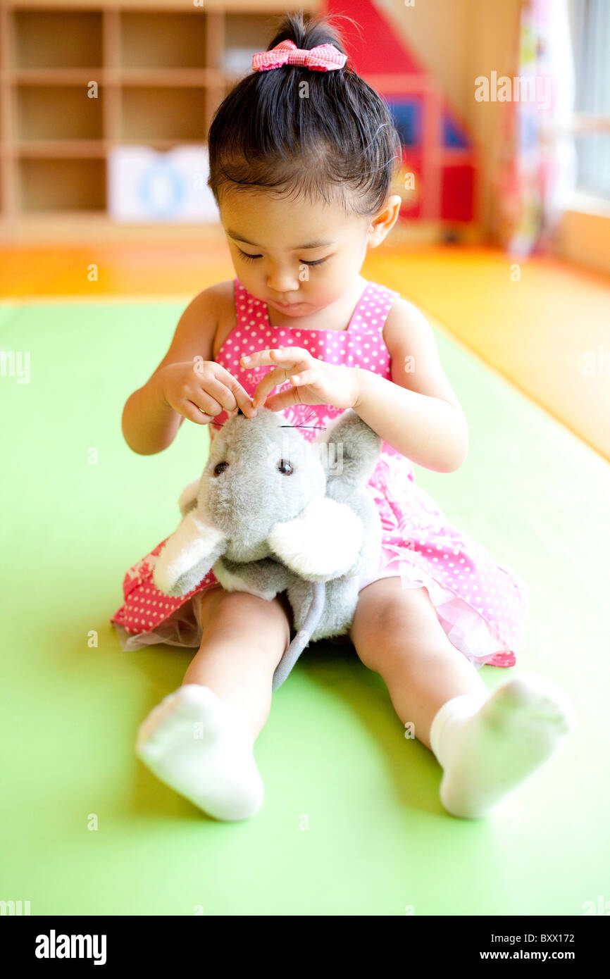 Girl Playing With Stuffed Animal Stock Photo - Alamy